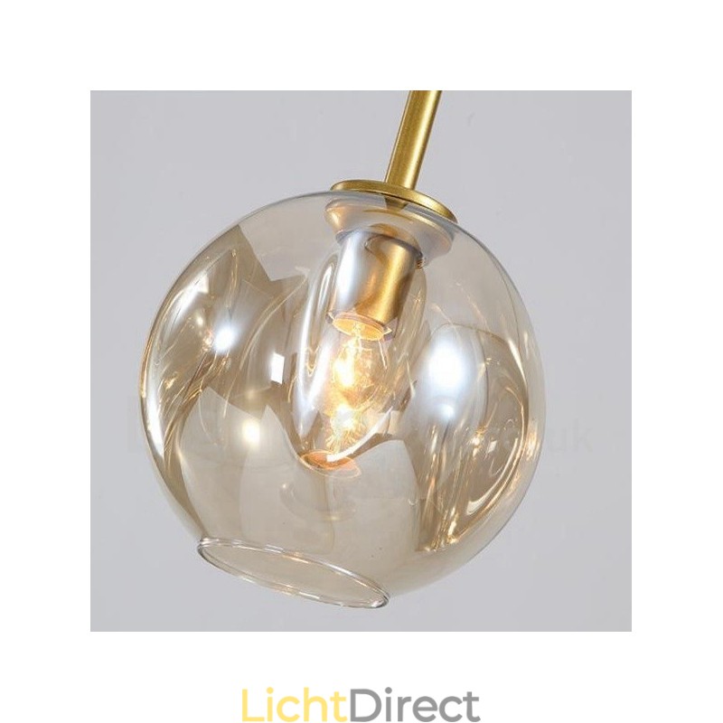 Moderne eigentijdse kroonluchter met 7 lampen en heldere glazen kap en lamp