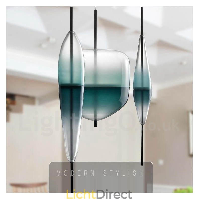 Moderne, eigentijdse hanglamp met glazen kap in kleurverloop